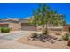 Single-story home with a two-car garage and drought-tolerant desert landscaping, ideal for low maintenance at 1254 E Thomas Dr, Casa Grande, AZ 85122