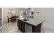 Kitchen island has granite countertops, stainless steel dishwasher, and dark cabinets at 1254 E Thomas Dr, Casa Grande, AZ 85122