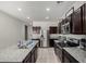 Gourmet kitchen featuring stainless appliances, granite countertops, and dark cabinetry at 1254 E Thomas Dr, Casa Grande, AZ 85122