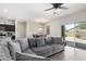 Open-concept living room with dining area, sliding glass doors, and connection to the modern kitchen at 1254 E Thomas Dr, Casa Grande, AZ 85122
