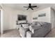 Cozy living room featuring a large sectional sofa, television, and neutral color palette at 1254 E Thomas Dr, Casa Grande, AZ 85122