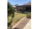 Green backyard space with patio, offering an inviting space for relaxation and outdoor activities at 14938 W Mauna Loa Ln, Surprise, AZ 85379