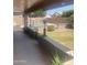 Backyard area featuring a pool, patio area with shade umbrellas, and outdoor seating at 14938 W Mauna Loa Ln, Surprise, AZ 85379