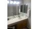 Bathroom with a vanity, mirror and lighting at 14938 W Mauna Loa Ln, Surprise, AZ 85379