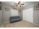 Bedroom with neutral walls, ceiling fan, and closet at 14938 W Mauna Loa Ln, Surprise, AZ 85379