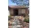 Charming single-story home with desert landscaping and covered entryway at 14938 W Mauna Loa Ln, Surprise, AZ 85379