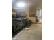 Spacious garage featuring a vehicle and a wall of storage cabinets for tools and equipment at 14938 W Mauna Loa Ln, Surprise, AZ 85379