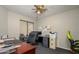 Functional home office with multiple work stations and natural light at 14938 W Mauna Loa Ln, Surprise, AZ 85379