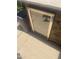 Outdoor home living featuring a home theater and outdoor trash can at 14938 W Mauna Loa Ln, Surprise, AZ 85379