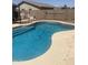 Sparkling pool with refreshing turquoise water and coping, perfect for relaxing and entertaining at 14938 W Mauna Loa Ln, Surprise, AZ 85379