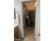 Walk-in closet featuring shelving and hanging racks with a variety of clothing items at 14938 W Mauna Loa Ln, Surprise, AZ 85379