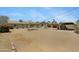 Backyard featuring minimal desert landscaping, hammock and rear exterior elevation at 1559 S Padre Rd, Apache Junction, AZ 85119