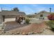 Wide backyard with a covered carport and minimal landscaping with a table and chairs at 1559 S Padre Rd, Apache Junction, AZ 85119