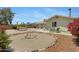 Backyard with low maintenance landscaping, table, chairs, and a hammock at 1559 S Padre Rd, Apache Junction, AZ 85119