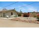 Backyard view with minimal desert landscaping, table, chairs and perimeter plants at 1559 S Padre Rd, Apache Junction, AZ 85119