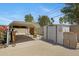 Backyard featuring a covered carport and adjacent storage shed at 1559 S Padre Rd, Apache Junction, AZ 85119