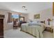 Bright bedroom showcases a large window, a dresser and a king-size bed at 1559 S Padre Rd, Apache Junction, AZ 85119