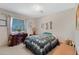 Cozy bedroom features a double bed, and a desk with a view to the outside at 1559 S Padre Rd, Apache Junction, AZ 85119