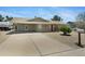 Inviting single-story home with a long driveway and low-maintenance landscaping at 1559 S Padre Rd, Apache Junction, AZ 85119