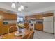 Bright eat-in kitchen with wood cabinets and standard appliances at 1559 S Padre Rd, Apache Junction, AZ 85119