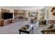 Comfortable living room featuring a brick fireplace and a telescope near the window at 1559 S Padre Rd, Apache Junction, AZ 85119