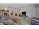 Cozy living room with brick fireplace and neutral carpeting at 1559 S Padre Rd, Apache Junction, AZ 85119