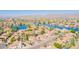 Stunning aerial view of the community featuring beautiful homes surrounding a large lake and mountain views at 16414 S 36Th St, Phoenix, AZ 85048