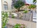 Beautifully landscaped front yard with vibrant flowers, decorative rocks, and a well-maintained walkway at 16414 S 36Th St, Phoenix, AZ 85048