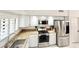 Well-equipped kitchen with stainless steel appliances, granite countertops, and ample cabinet space at 16414 S 36Th St, Phoenix, AZ 85048