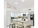 Modern kitchen with white cabinets, stainless steel appliances, and a breakfast bar with seating at 16414 S 36Th St, Phoenix, AZ 85048