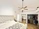 Main bedroom boasts vaulted ceilings, ceiling fan, carpet flooring, and walk-in closet at 16414 S 36Th St, Phoenix, AZ 85048