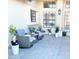 Relaxing outdoor patio with comfortable seating, tiled flooring, and stylish decor at 16414 S 36Th St, Phoenix, AZ 85048