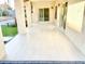 Beautiful covered patio area featuring tile floors, sliding doors, and multiple support beams at 16414 S 36Th St, Phoenix, AZ 85048