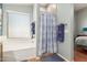 Bathroom showcasing a bathtub with shower, a window, and tile flooring at 16441 N 138Th Ave, Surprise, AZ 85374