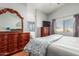 Spacious bedroom featuring hardwood floors, a window, and ample natural light at 16441 N 138Th Ave, Surprise, AZ 85374