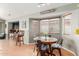 Charming breakfast nook with tile flooring, window blinds, and backyard views, ideal for casual dining at 16441 N 138Th Ave, Surprise, AZ 85374