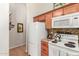 Functional kitchen featuring modern appliances, granite counters, and tile backsplash at 16441 N 138Th Ave, Surprise, AZ 85374