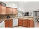 Open concept kitchen showcasing cabinets, granite countertops, and connection to the living area at 16441 N 138Th Ave, Surprise, AZ 85374