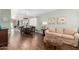 Open-concept living and dining area with hard wood floors, perfect for entertaining and everyday living at 16441 N 138Th Ave, Surprise, AZ 85374