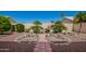 Serene backyard with desert landscaping, perfect for enjoying the outdoors at 17585 N Coyote Lakes Pkwy, Surprise, AZ 85378