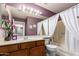 Compact bathroom featuring a vanity, tub, and traditional fixtures at 17585 N Coyote Lakes Pkwy, Surprise, AZ 85378