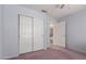 Bedroom with closet, ensuite, and calming light-blue painted walls at 17585 N Coyote Lakes Pkwy, Surprise, AZ 85378