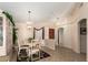 Cozy dining area featuring chandelier lighting, tiled floors, and neutral paint at 17585 N Coyote Lakes Pkwy, Surprise, AZ 85378