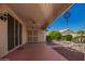 Covered patio with ceiling fan, perfect for outdoor relaxation and entertaining at 17585 N Coyote Lakes Pkwy, Surprise, AZ 85378