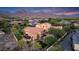 Expansive aerial view of a luxurious home featuring a tile roof, multiple outdoor seating areas, and mature landscaping at 19054 N 97Th Pl, Scottsdale, AZ 85255