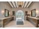 An elegant primary bathroom with dual vanities and archways offers a luxurious and serene retreat at 19054 N 97Th Pl, Scottsdale, AZ 85255