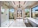 A bright bathroom offers a glass shower, soaking tub, and serene views, creating a spa-like experience at 19054 N 97Th Pl, Scottsdale, AZ 85255