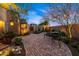 Beautifully landscaped courtyard with paved brick pathway and outdoor seating creating a tranquil retreat at 19054 N 97Th Pl, Scottsdale, AZ 85255