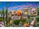 Stunning desert home with classic architectural design, front terrace, and xeriscaped garden at 19054 N 97Th Pl, Scottsdale, AZ 85255