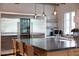 This kitchen boasts a large island with bar seating, stainless steel appliances, and pendant lighting at 19054 N 97Th Pl, Scottsdale, AZ 85255